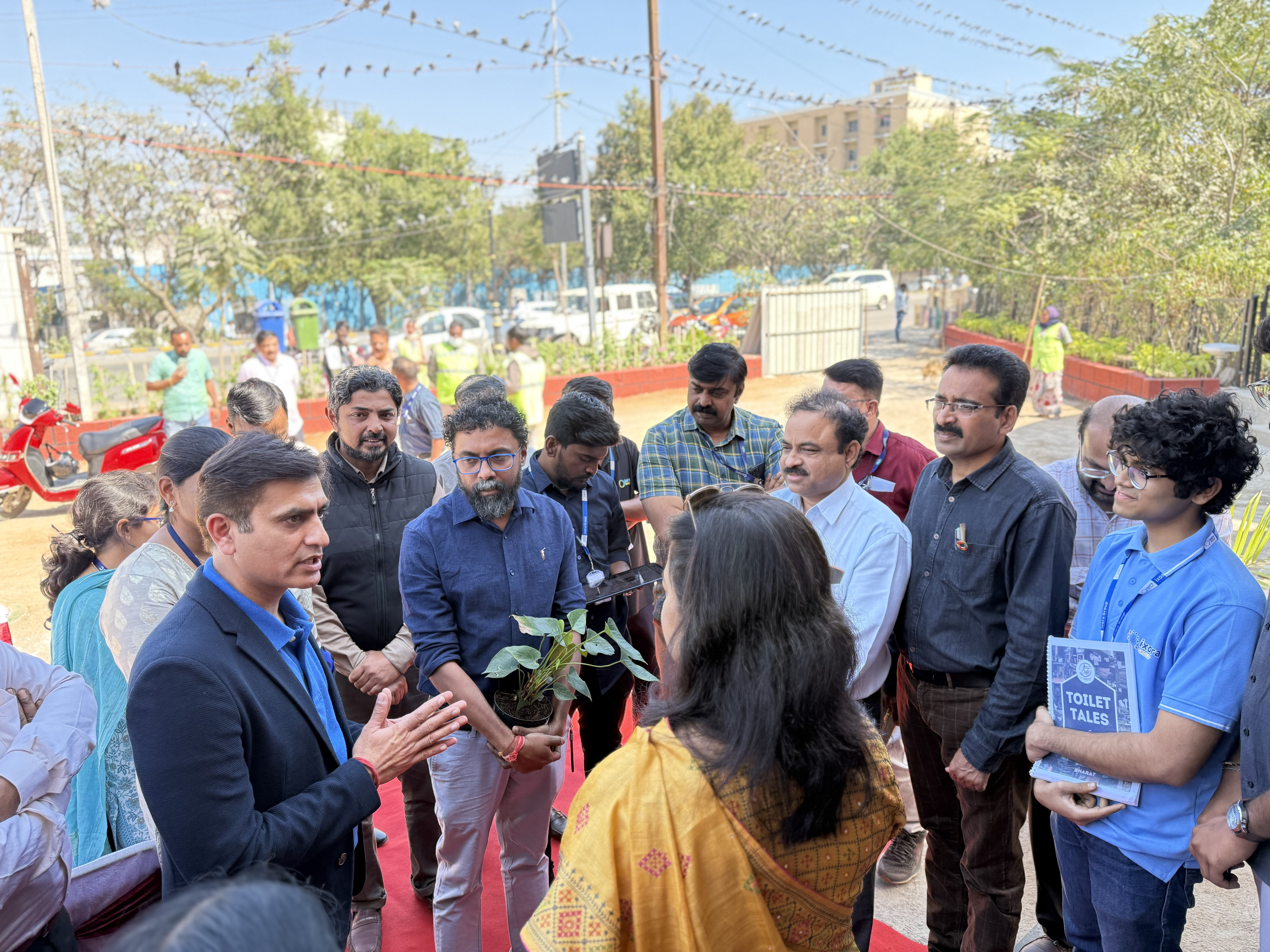 Team presenting Toilet Tales book
