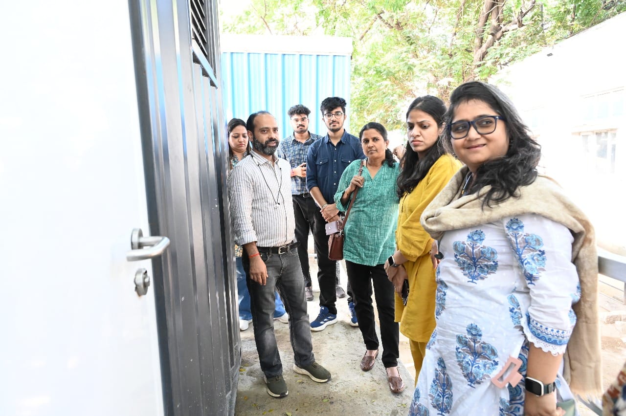 Stakeholders discussing zero-discharge sanitation technology