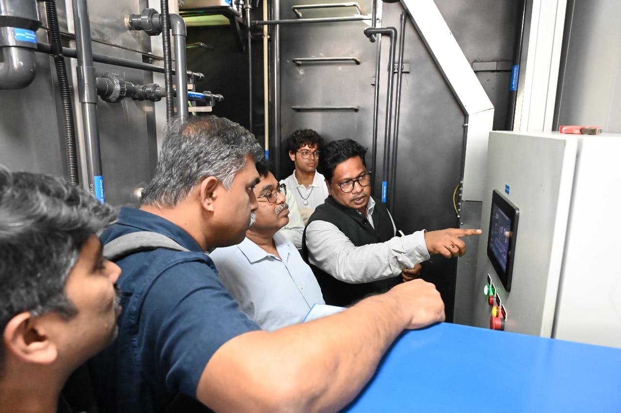 Sanitation innovation experts examining treatment system